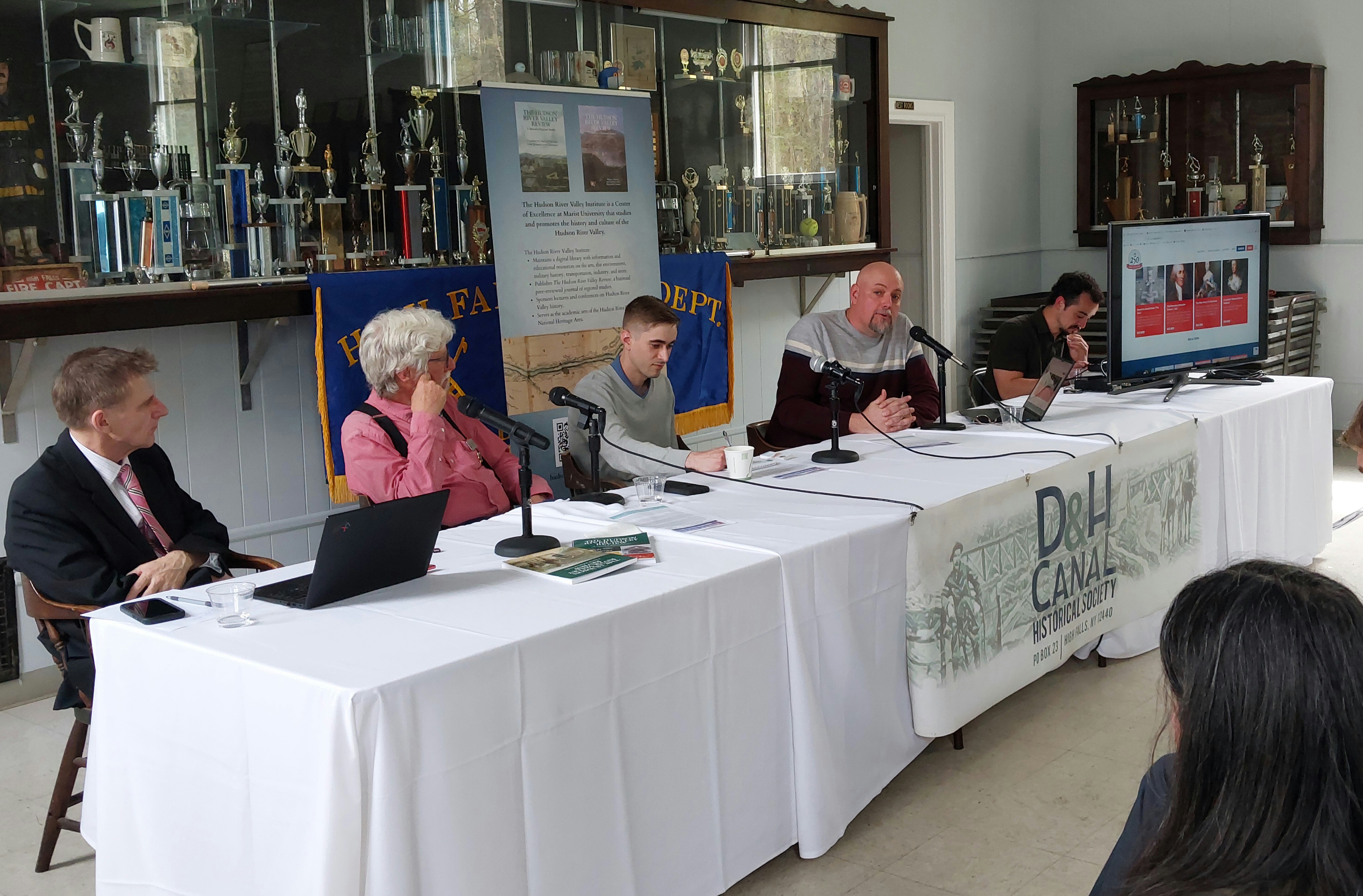 (Left to Right) Moderator Dr. Thomas Wermuth, Bill Merchant, Eddie Moran, and Devin Lander sitting on a panel.