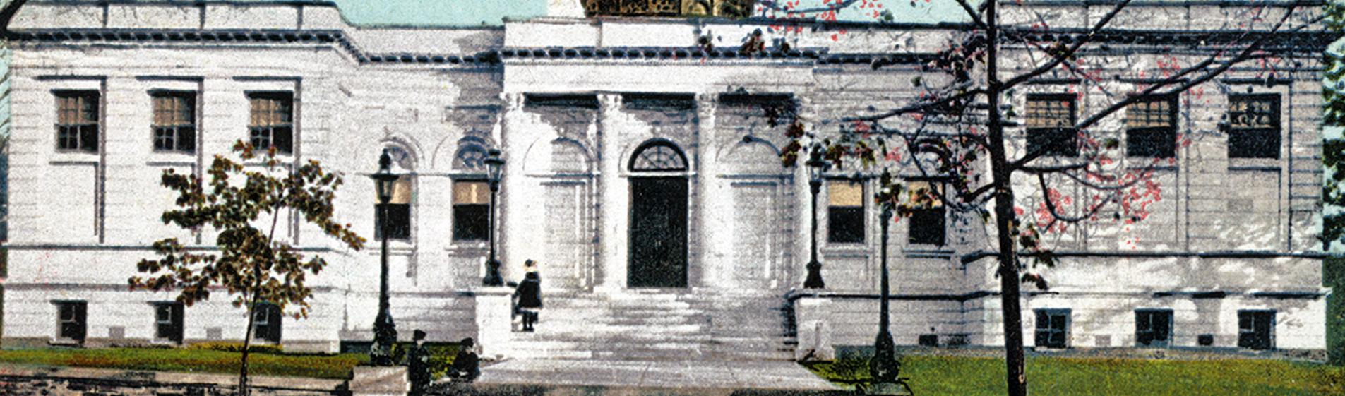 Image of a white stone library building with people on the steps
